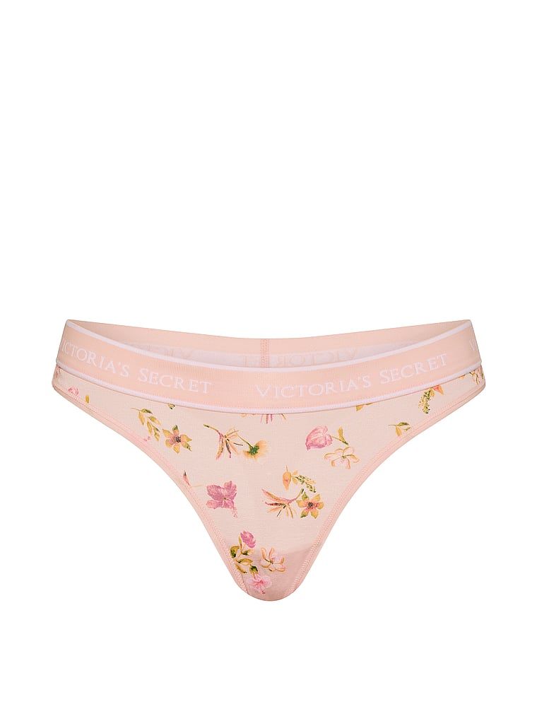 Bavlněné tanga s logem v pase. Produkt je květinové barvy a pochází z kolekce Cotton.