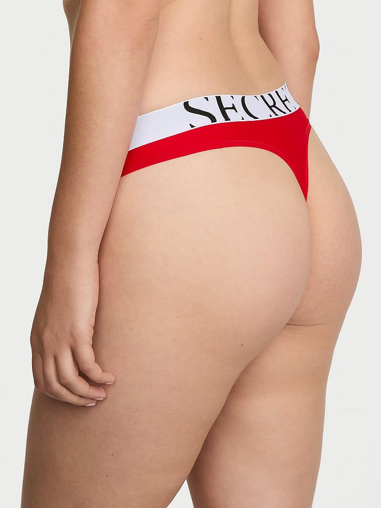 Tanga s logem Cool. Produkt je červené barvy a pochází z kolekce Victoria's Secret.