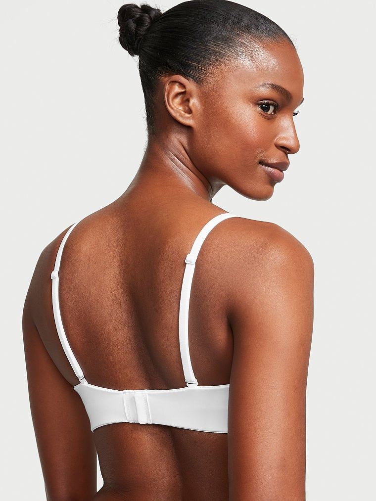 Mírně vyztužená podprsenka bez ramínek. Produkt je bílý a pochází z kolekce Body by Victoria.