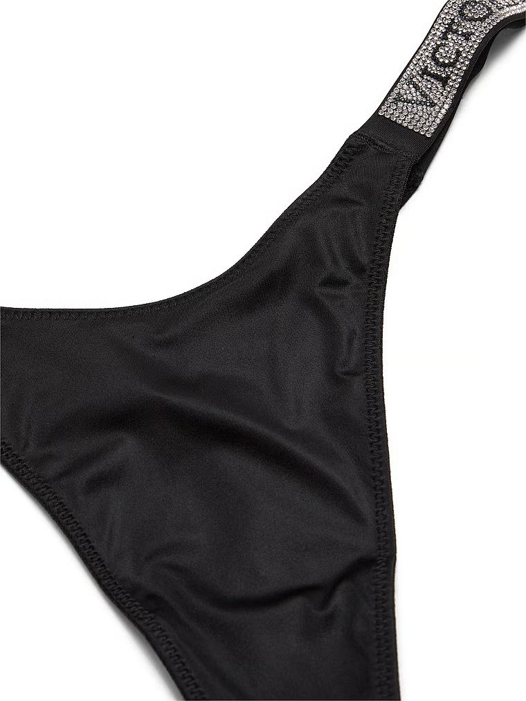 Tanga s lesklými popruhy Shine Strap. Produkt je černý a pochází z kolekce Very Sexy.