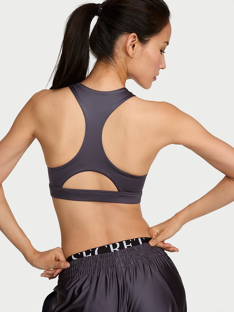 Sportovní podprsenka vyrobená z lesklého materiálu VSX GlossyTech. Produkt je šedé barvy a pochází z kolekce VSX.
