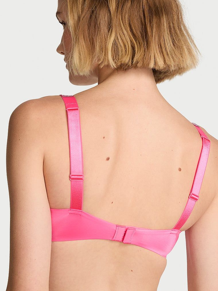 Push-up zvětšující podprsenka 2 velikosti Bombshell Shine Strap. Produkt je růžové barvy a pochází z kolekce Very Sexy.