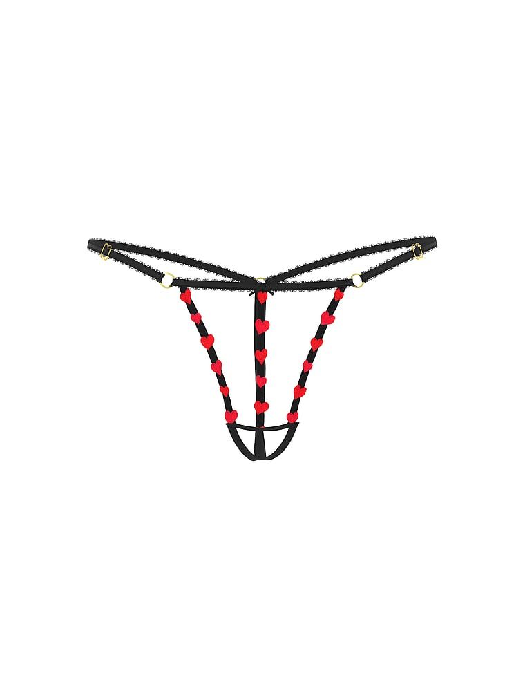 Tanga bez stepu Lákadlo s ramínky. Produkt je vzorovaný a pochází z kolekce Very Sexy.