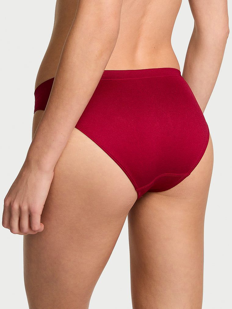 Bezešvé lesklé bikiny kalhotky. Produkt má červenou barvu a pochází z kolekce Bezešvé.