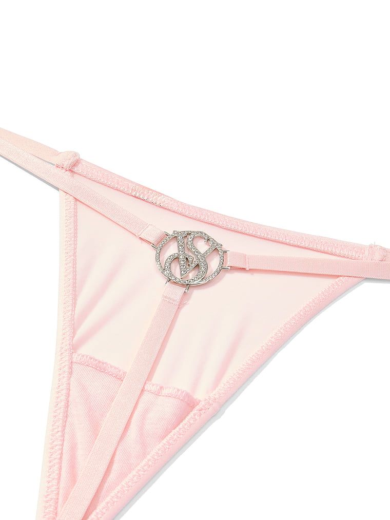 Tanga s lesklým monogramem na zádech. Produkt je růžové barvy a pochází z kolekce Very Sexy.