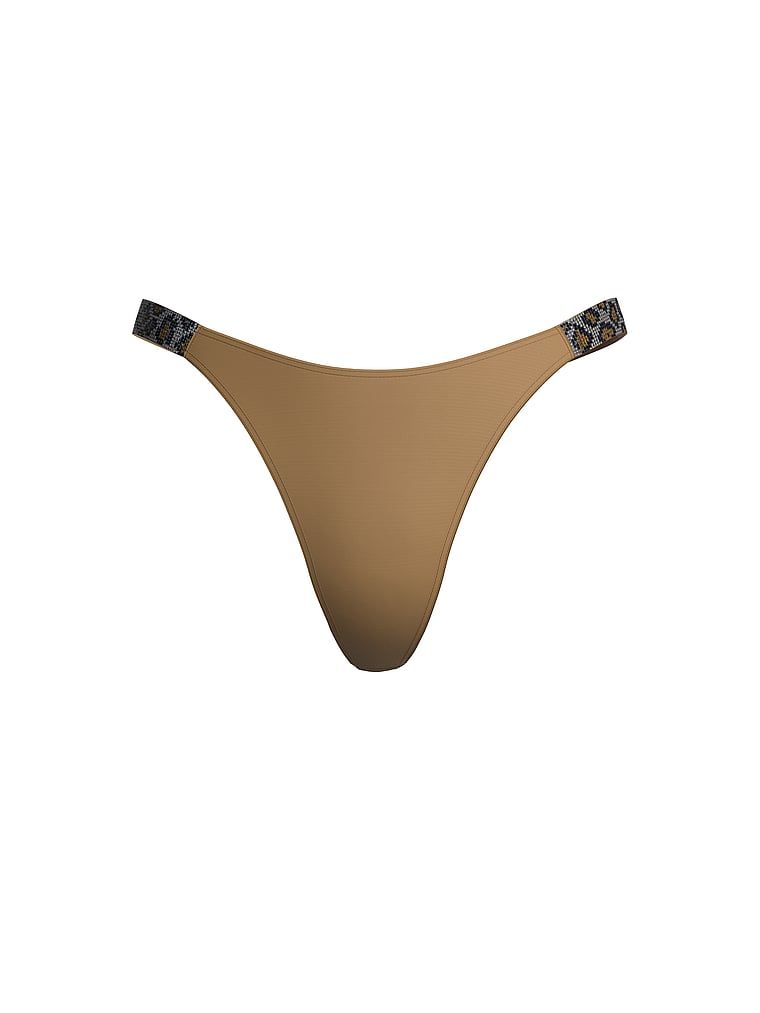 Tanga s lesklými ramínky Shine Strap. Produkt je hnědé barvy a pochází z kolekce Very Sexy.