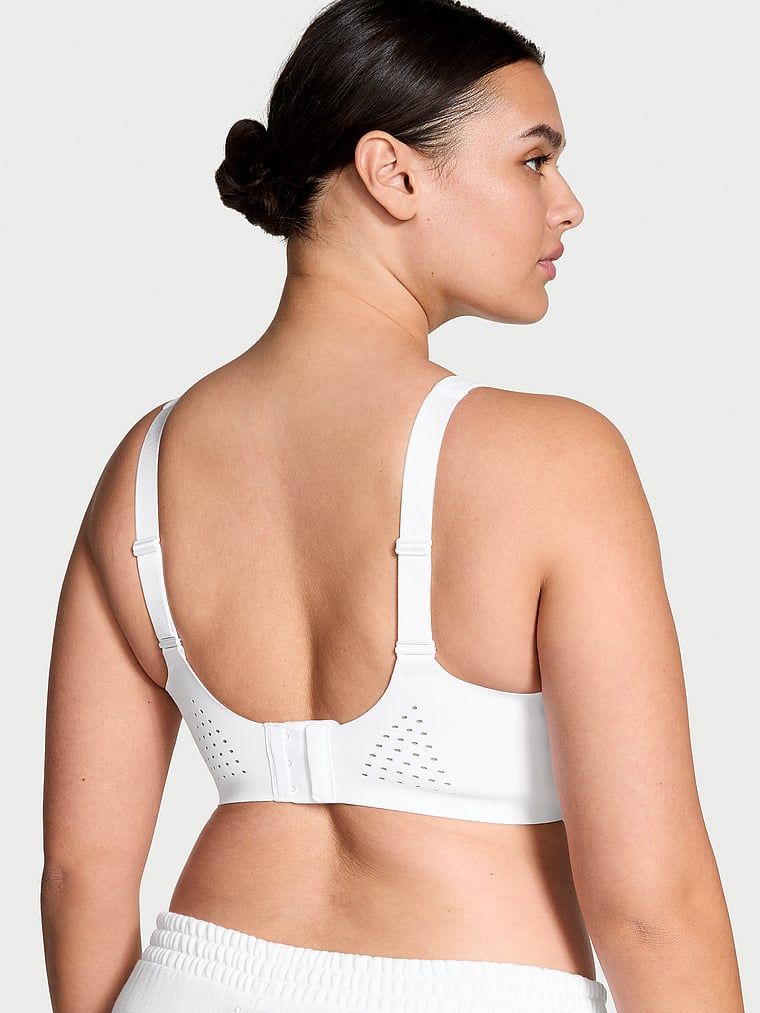 Sportovní podprsenka s maximální podporou Featherweight Max. Produkt je bílý a pochází z kolekce VSX.