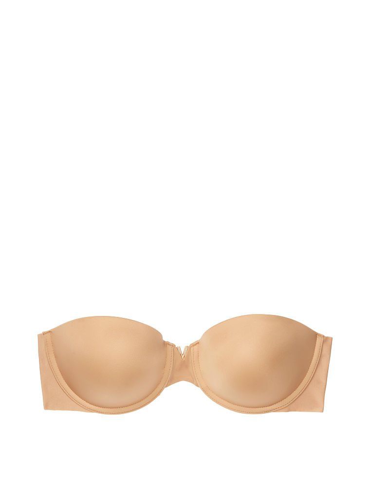 Sexy iluze bez ramínek povznášejí bezramennou push-up podprsenku. Produkt je béžový a pochází z kolekce Victoria's Secret Bare.