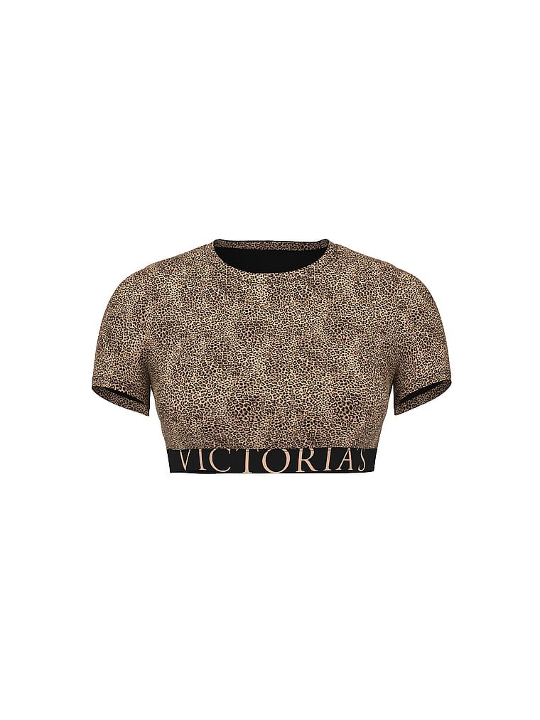 Bavlněný crop top s krátkými rukávy. Produkt je vzorovaný a pochází z kolekce triček.