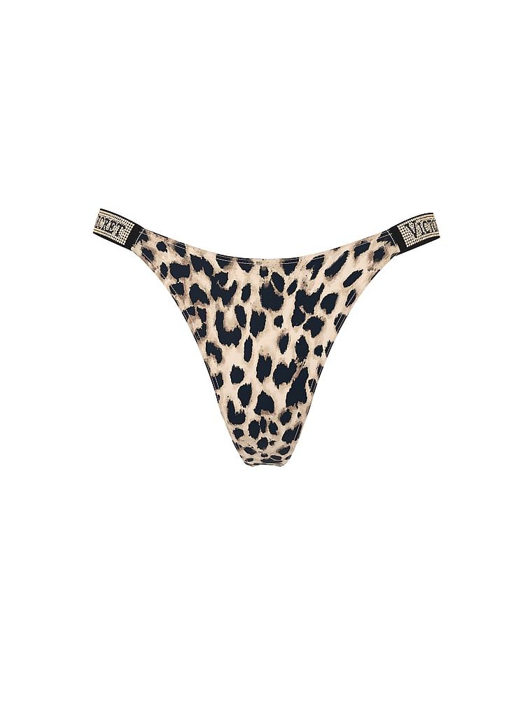 Tanga s lesklými pásky Shine. Produkt je vícebarevný a pochází z kolekce Very Sexy.