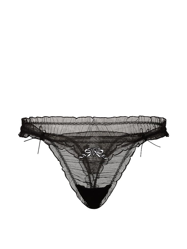 Tanga s volánky a síťovanými mašlemi. Produkt je černý a pochází z kolekce Dream Angels.