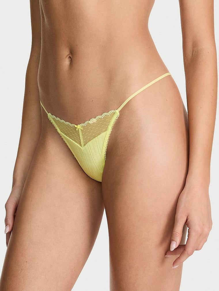 Tanga Krajka Pointelle. Produkt je žluté barvy a pochází z kolekce Victoria's Secret.