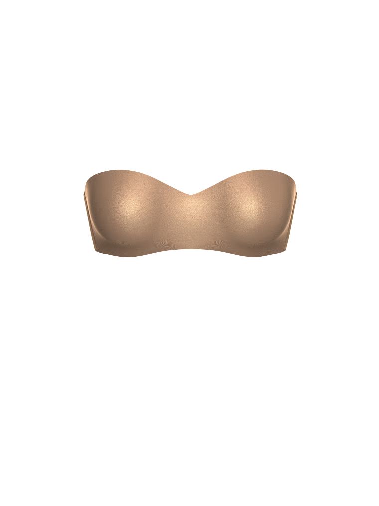 Mírně vyztužená podprsenka bez ramínek. Produkt je béžový a pochází z kolekce Body by Victoria.