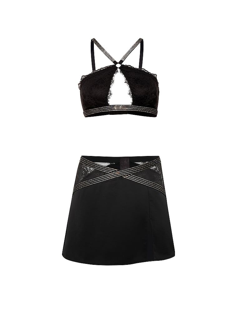 Sada – braletka a sukně Shine Strap. Produkt je černý a pochází z kolekce Very Sexy.