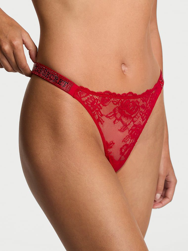 Krajková tanga s lesklými ramínky Shine Strap. Produkt je červené barvy a pochází z kolekce Very Sexy.