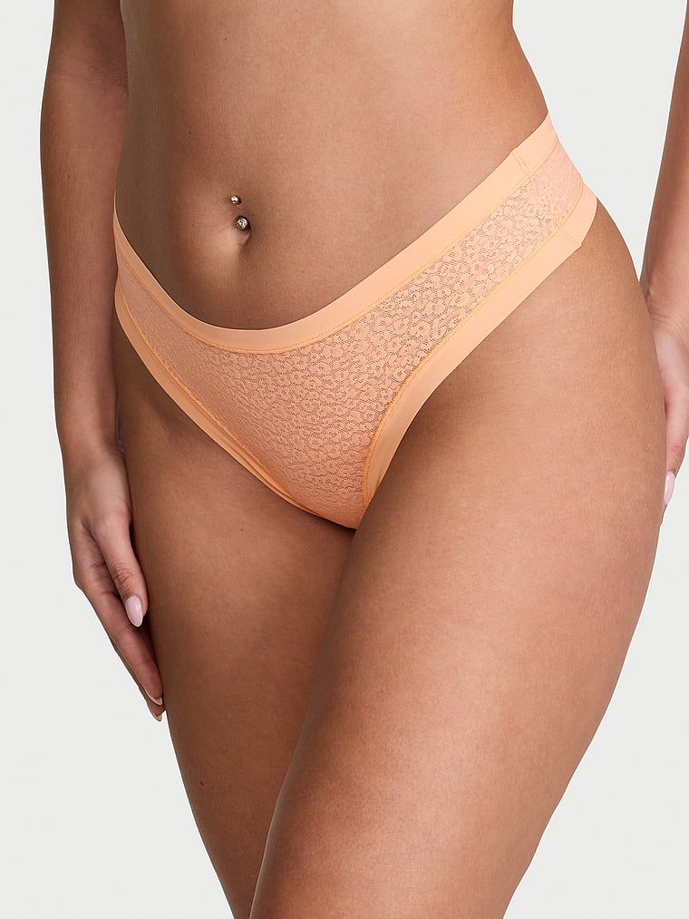 Tanga s leopardím vzorem jako Leopard. Produkt je oranžové barvy a pochází z kolekce No-Show.