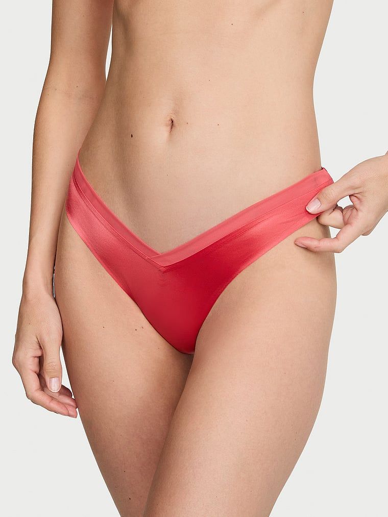 Tanga s ramínky na zádech Sheer Reveal. Produkt je růžové barvy a pochází z kolekce Very Sexy.