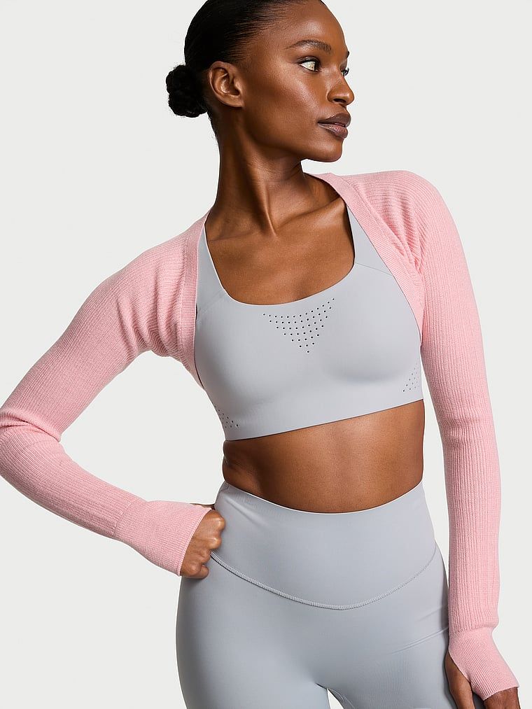 Rib Knit s dlouhým rukávem bolero svetr. Produkt je růžové barvy a pochází z kolekce VSX.