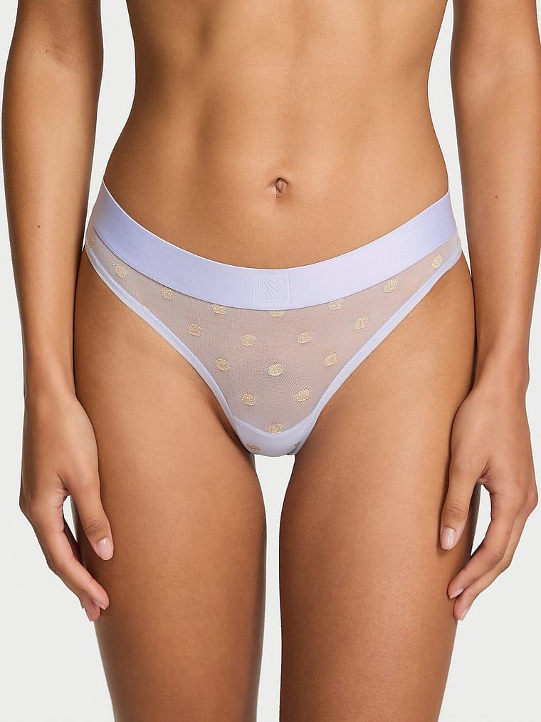 Průhledná tanga ze síťoviny Heritage Shimmer. Výrobek má zlatou barvu a pochází z kolekce Cotton.