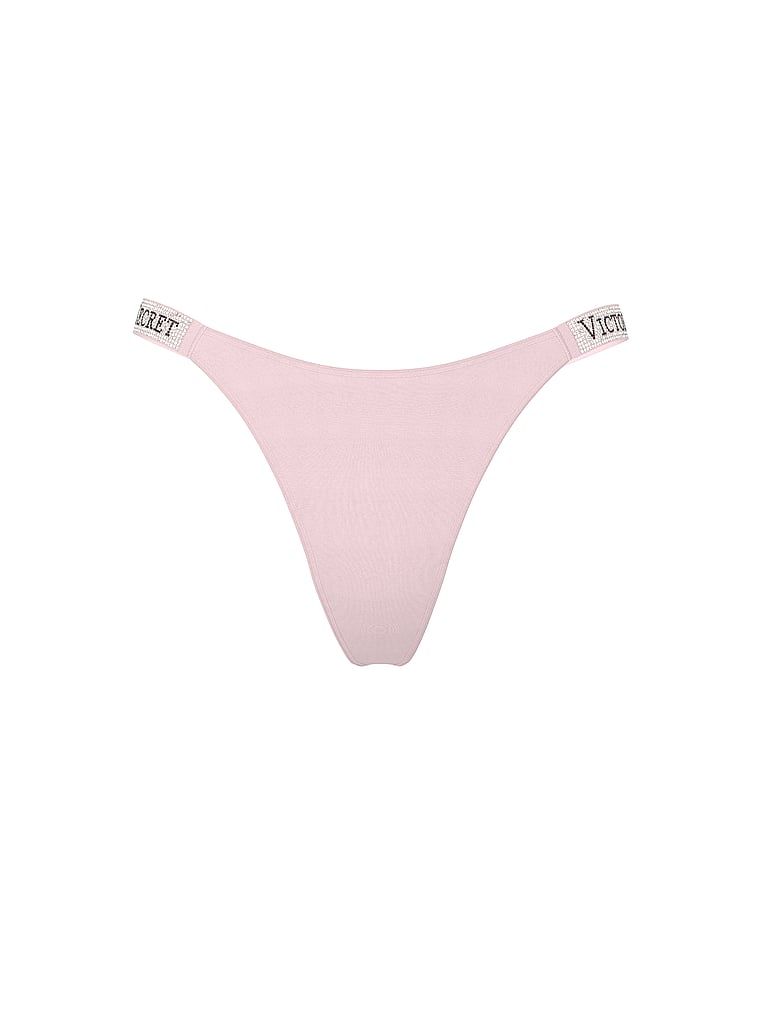 Tanga s lesklými ramínky Shine Strap. Produkt je růžové barvy a pochází z kolekce Very Sexy.