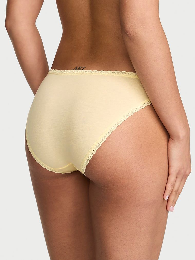 Bavlněné kalhotky s krajkovými bikinami s krajkovým lemováním. Produkt je žluté barvy a pochází z kolekce Lace Trim.