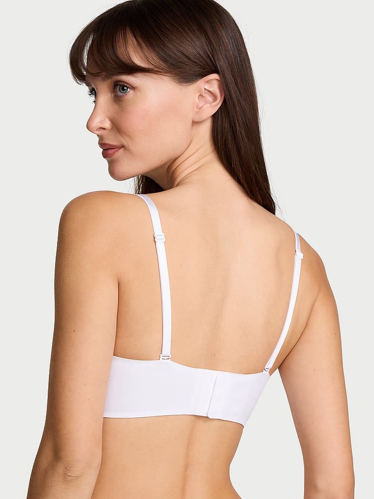 Push-up podprsenka bez ramínek 2 velikosti Bombshell. Produkt je bílé barvy a pochází z kolekce Invisible by Victoria's Secret.