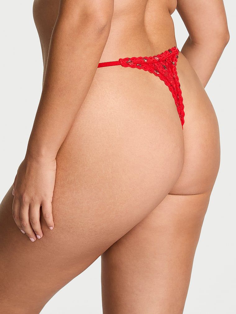 Krajková krajková tanga. Produkt má květinovou barvu a pochází z kolekce Lacie.