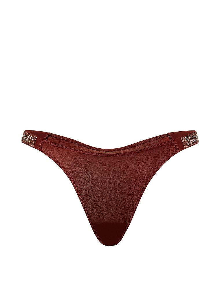 Tanga s lesklými ramínky Shine Strap. Produkt je vzorovaný a pochází z kolekce Very Sexy.