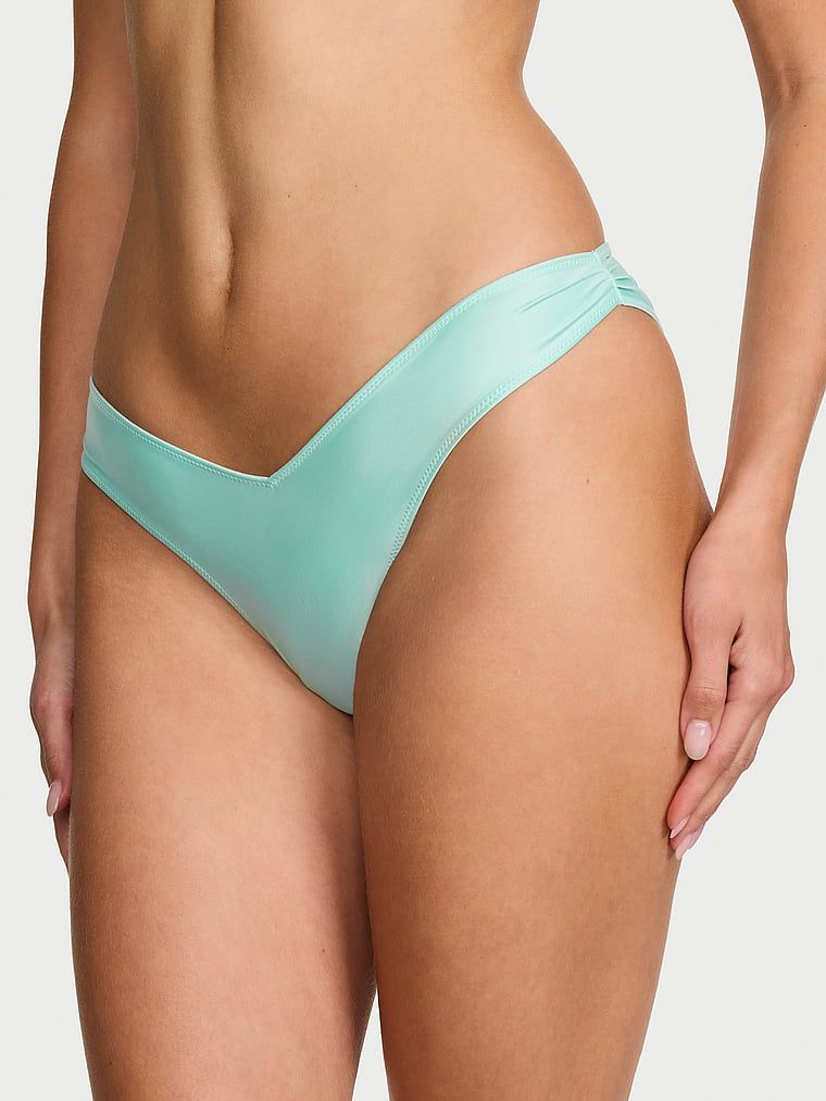 Satónové brazilské saténové kalhotky s mašlí. Produkt je modré barvy a pochází z kolekce Dream Angels.