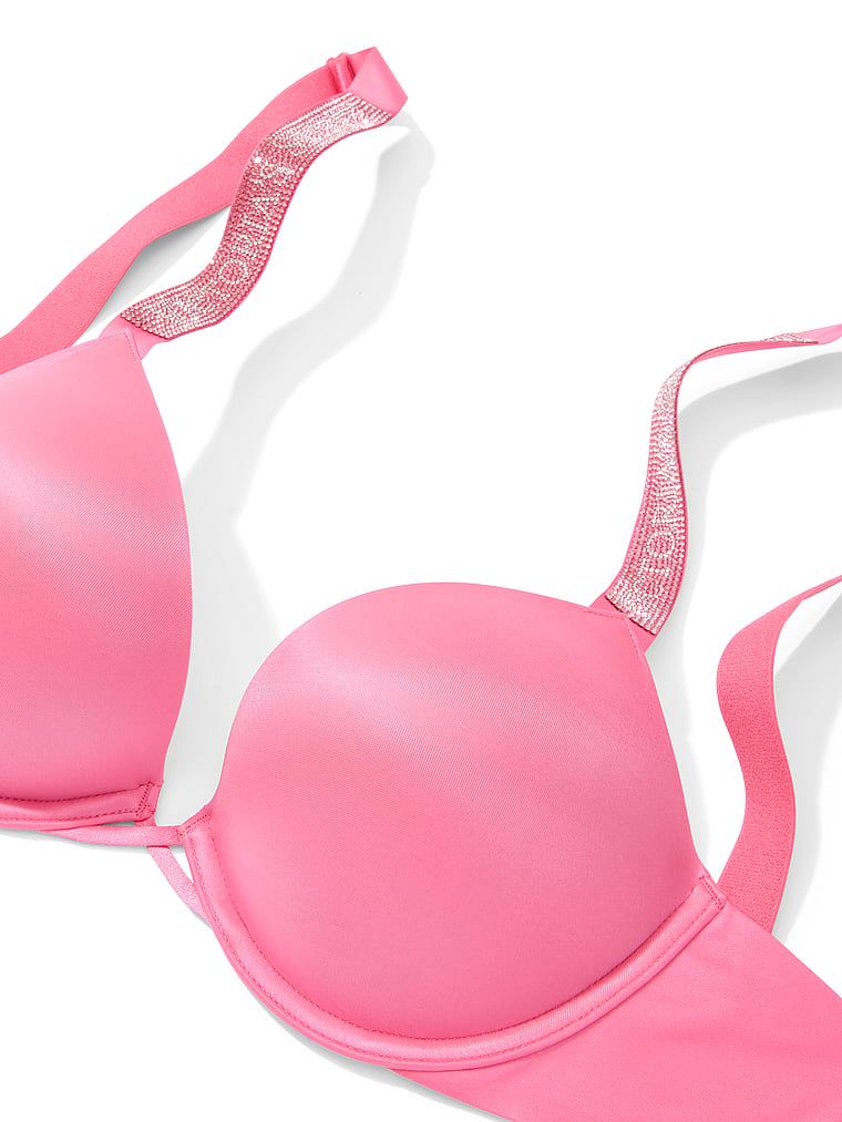 Push-up zvětšující podprsenka 2 velikosti Bombshell Shine Strap. Produkt je růžové barvy a pochází z kolekce Very Sexy.
