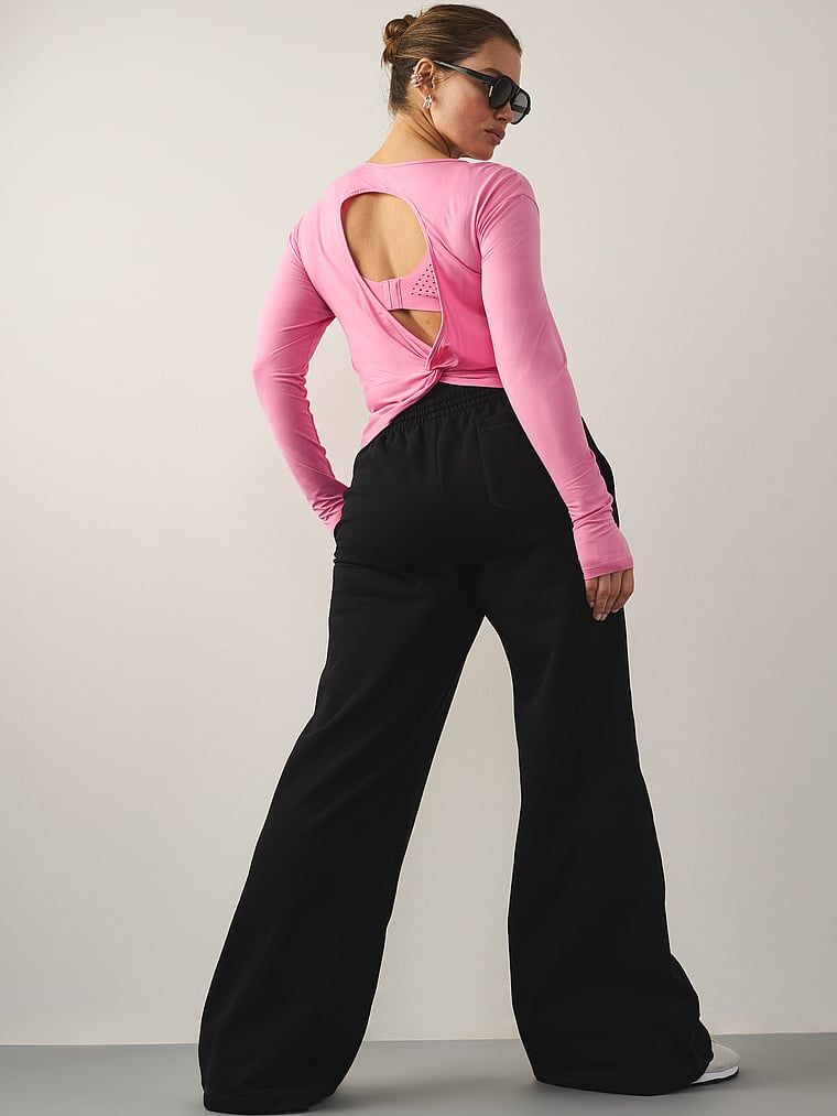 VSX halenka s výřezem a splývajícím výřezem. Produkt je růžové barvy a pochází z kolekce VSX.