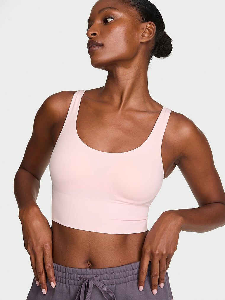 VSX Elevate sportovní podprsenka s hladkým povrchem. Produkt je růžové barvy a pochází z kolekce VSX.