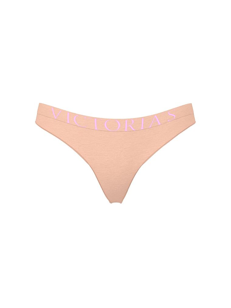 Logo s výbuchem bavlněných tang. Produkt je růžové barvy a pochází z kolekce Cotton.