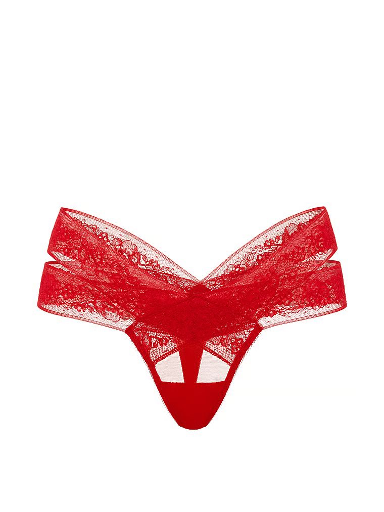 Tanga s výstřihy a krajkou s páskami. Produkt je červené barvy a pochází z kolekce Very Sexy.