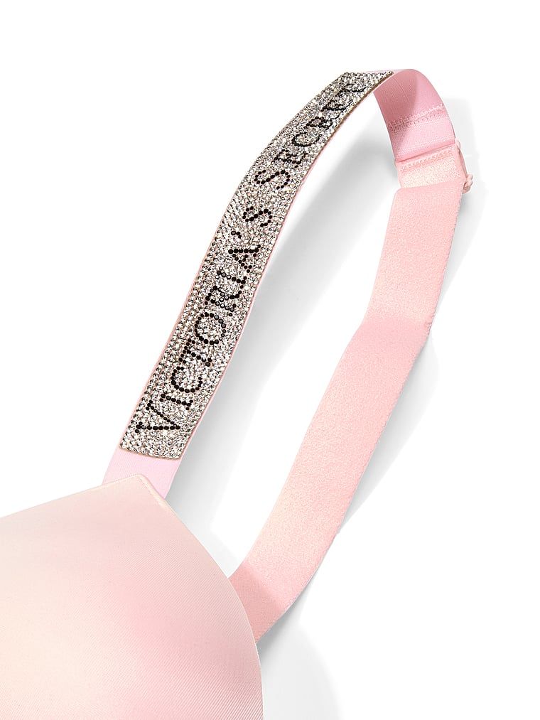 Push-up zvětšující podprsenka 2 velikosti Bombshell Shine Strap. Produkt je růžové barvy a pochází z kolekce Very Sexy.
