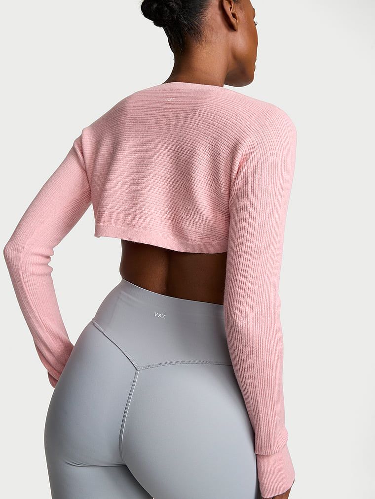 Rib Knit s dlouhým rukávem bolero svetr. Produkt je růžové barvy a pochází z kolekce VSX.