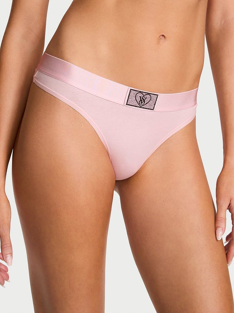 Bavlněné tanga s lesklým logem Heart Shine Patch. Produkt je růžové barvy a pochází z kolekce Cotton.