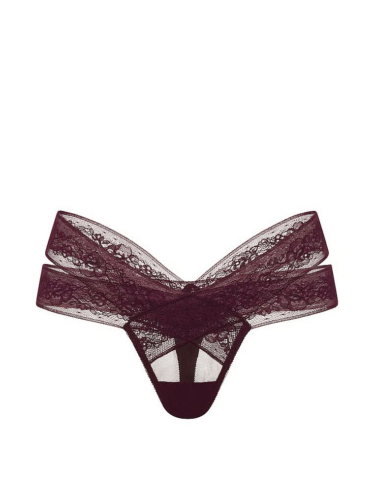 Tanga s výstřihy a krajkou s páskami. Produkt je fialové barvy a pochází z kolekce Very Sexy.