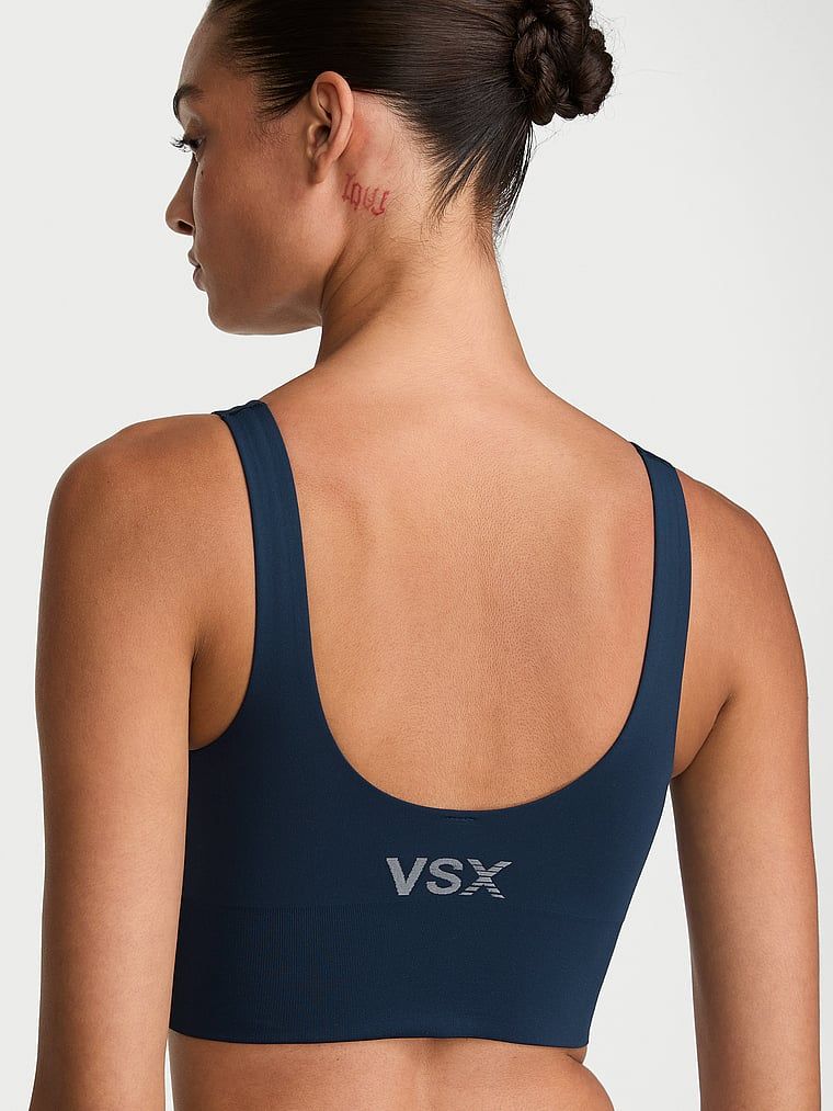 VSX Elevate sportovní podprsenka s hladkým povrchem. Produkt je modré barvy a pochází z kolekce VSX.