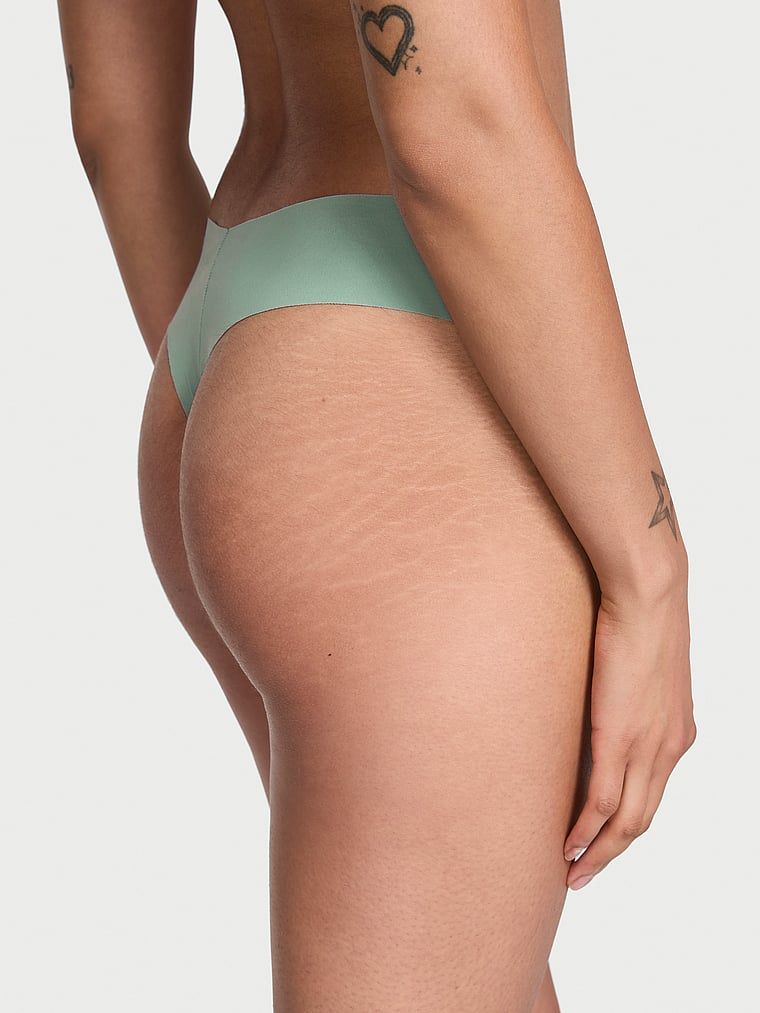 Bezešvá tanga bez show. Produkt má zelenou barvu a pochází z kolekce No-Show.