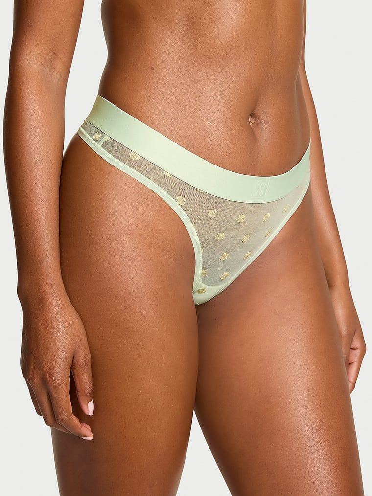 Průhledná tanga ze síťoviny Heritage Shimmer. Výrobek má zlatou barvu a pochází z kolekce Cotton.