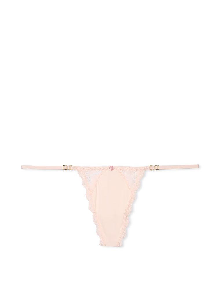 Krajková tanga s nastavitelnými V-String popruhy s lemováním na šněrování. Produkt je růžový a pochází z kolekce Dream Angels.