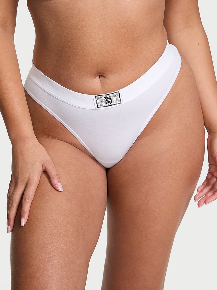 Bavlněná tanga s lesklým logem Shine Patch. Výrobek je bílé barvy a pochází z kolekce Cotton.