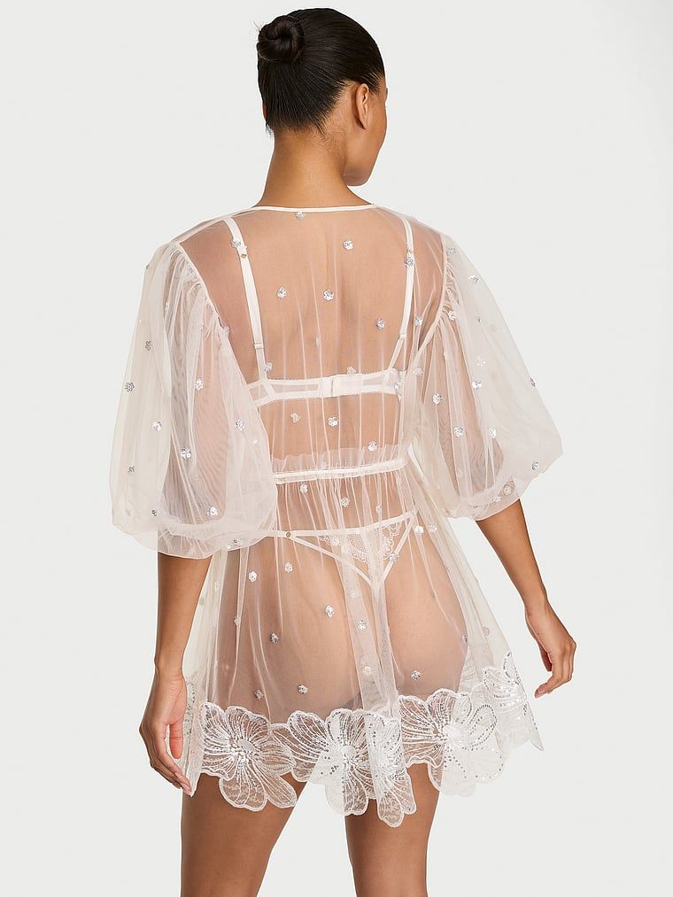 Průhledný župan pro nevěstu Atelier Bridal. Produkt je vzorovaný a pochází z kolekce Dream Angels.