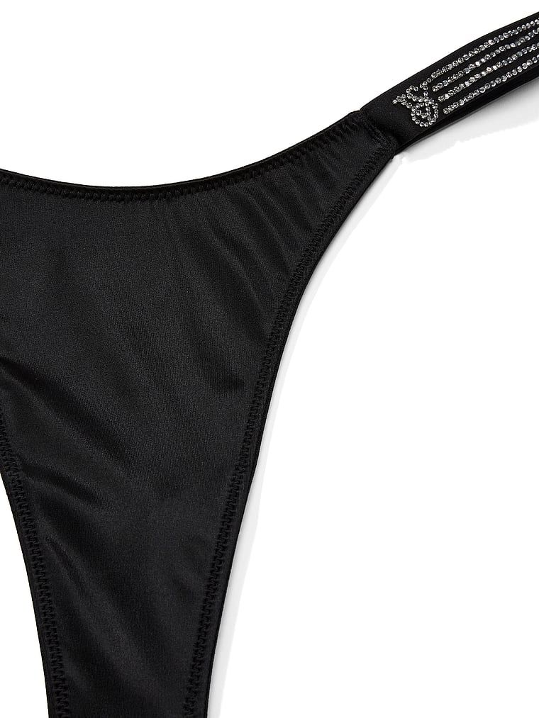 Tanga s lesklými pruhy Shine. Produkt je černý a pochází z kolekce Very Sexy.