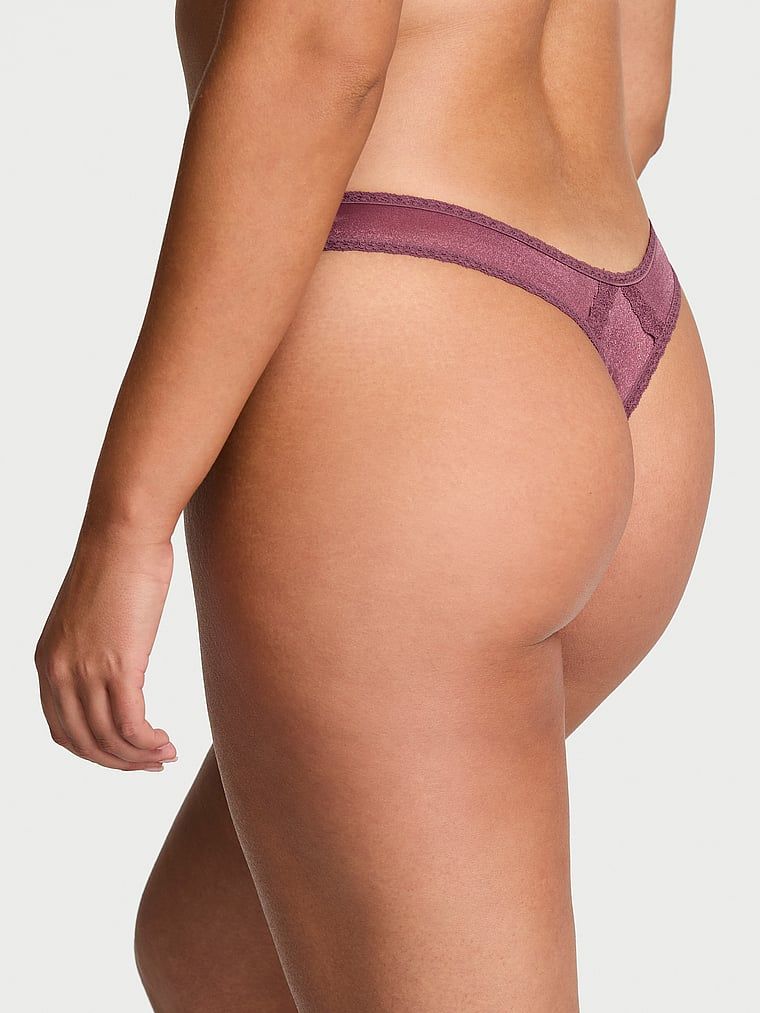 Sheer Shimmer Shimmer Shiny Thong. Produkt je růžové barvy a pochází z kolekce Dream Angels.