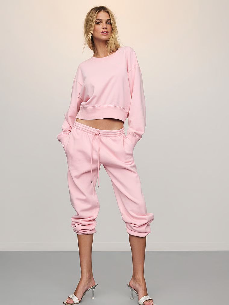 Mikina krátkého střihu Obsessed Terry. Produkt je růžové barvy a pochází z kolekce Angel Essentials.