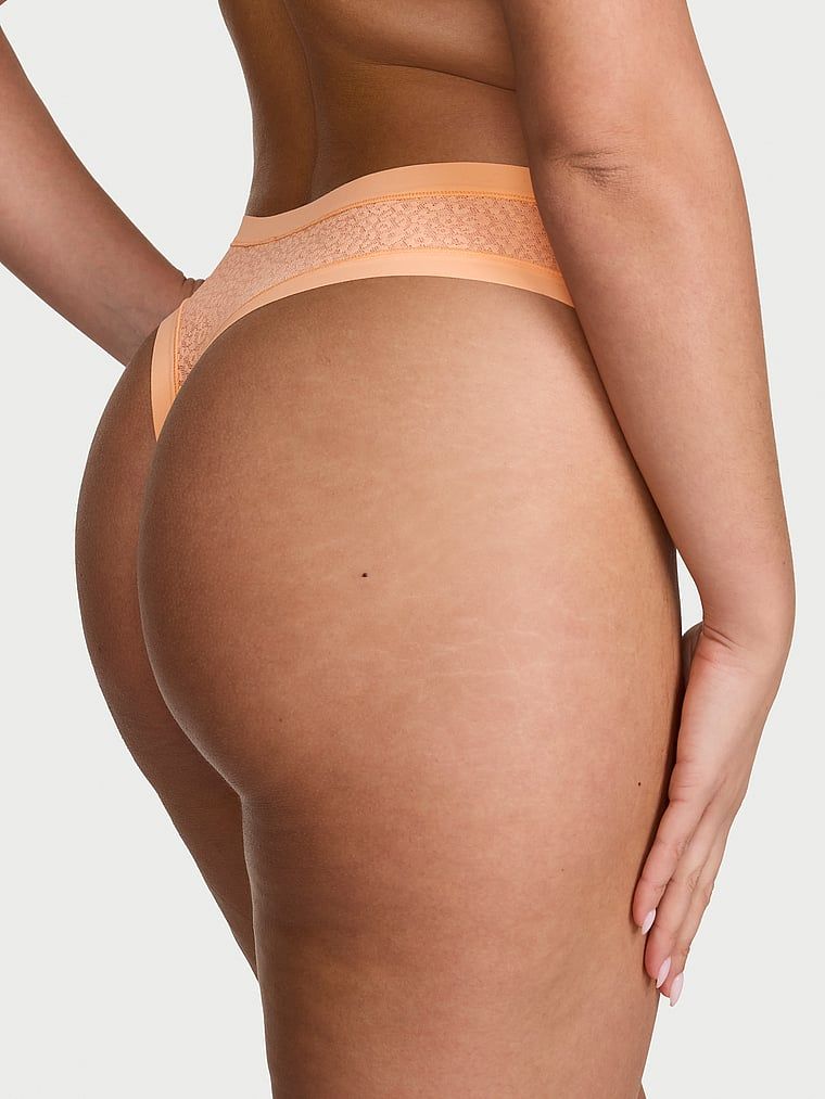 Tanga s leopardím vzorem jako Leopard. Produkt je oranžové barvy a pochází z kolekce No-Show.