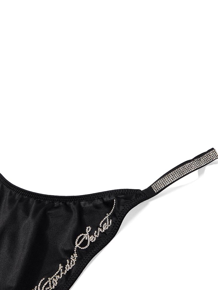 Strings Shine Script. Produkt je černý a pochází z kolekce Very Sexy.
