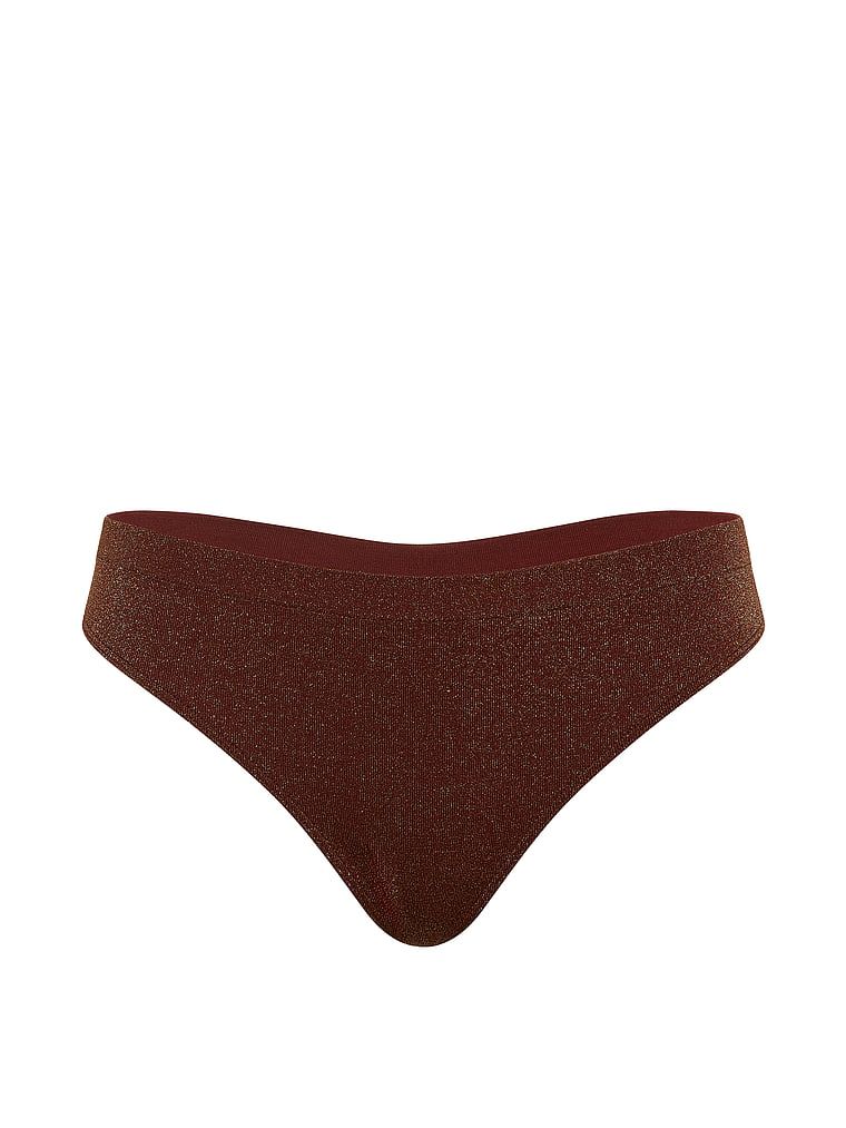 Tanga vyrobená z lesklého materiálu Shimmer. Produkt je hnědé barvy a pochází z kolekce Seamless.